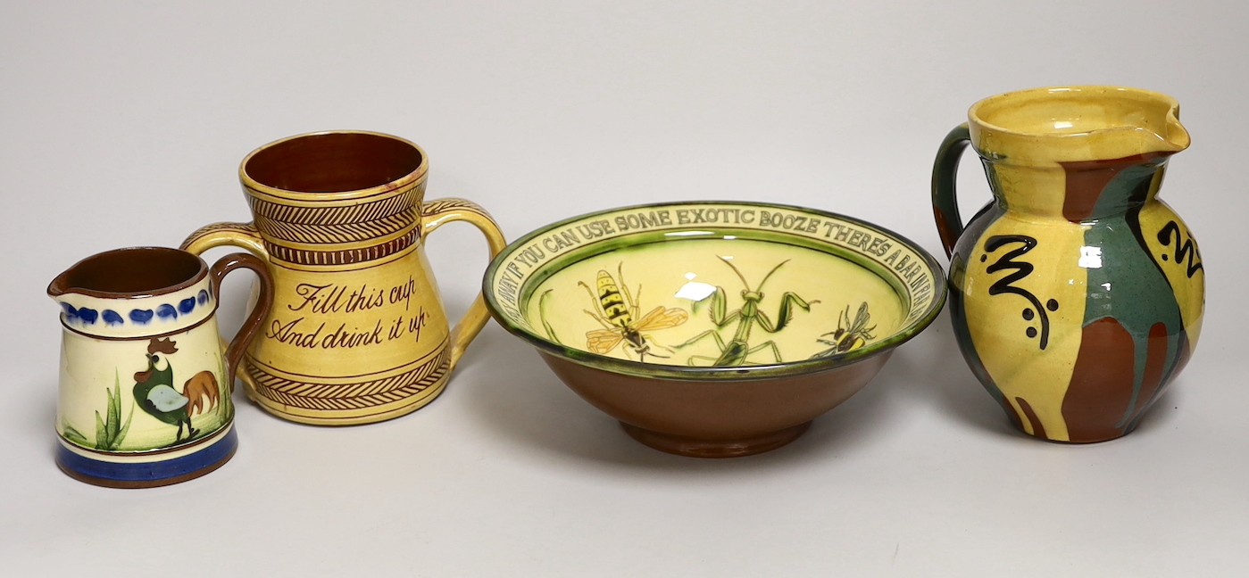 Margaret Brompton studio pottery bowl with insects, together with a slipware jug, a Longpark, Torquay small cockerel jug, and a Susan Juniper slipware jug, largest 21cm diameter, (4)